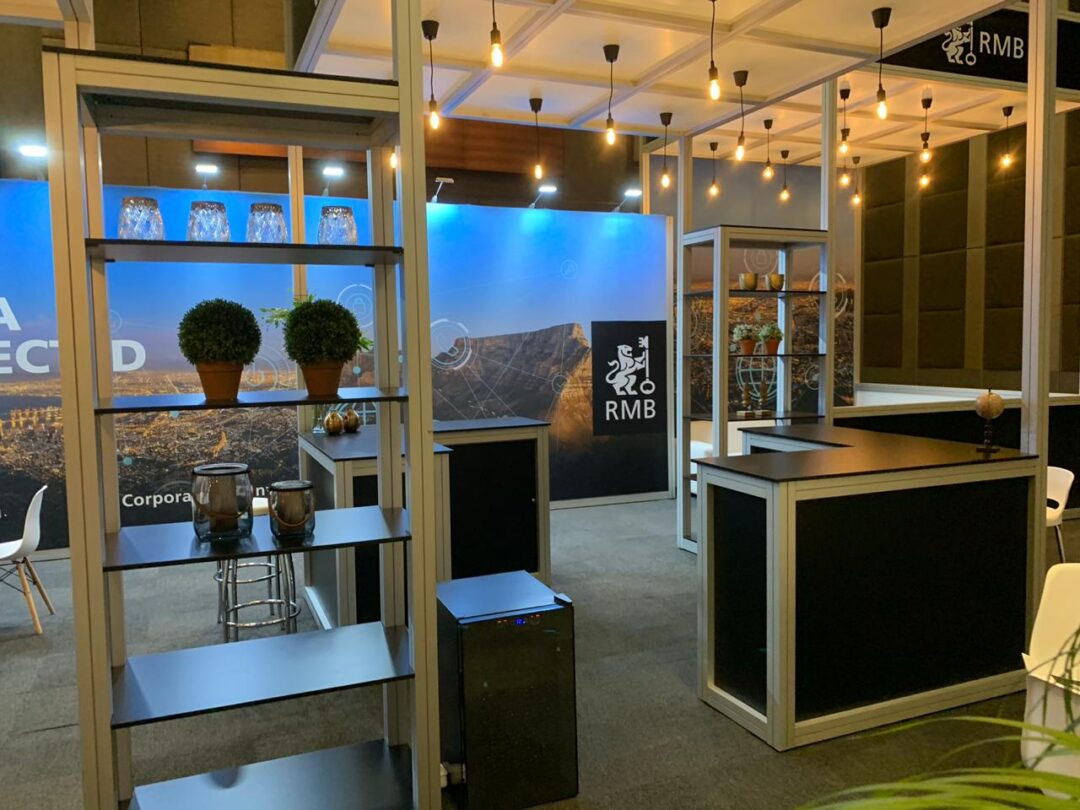 Completed EBS exhibition space with backlit displays and branding walls