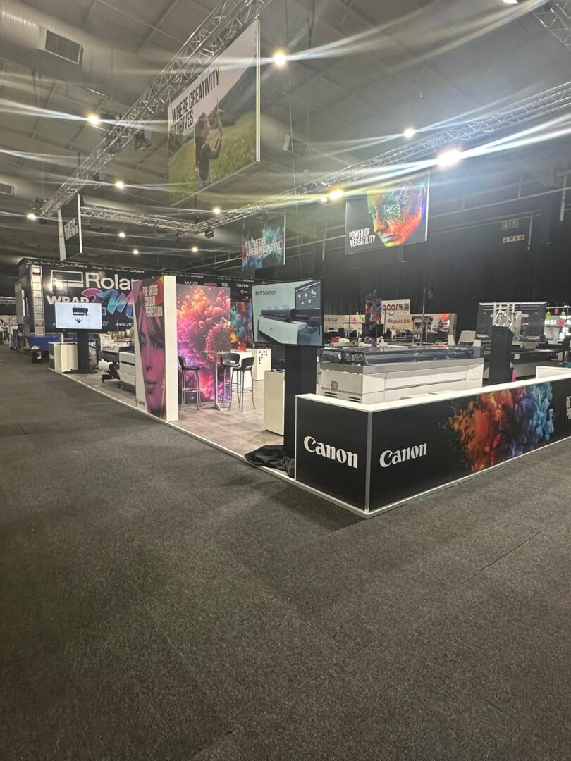 EBS custom-built event stand with flooring, furniture, and lighting setup