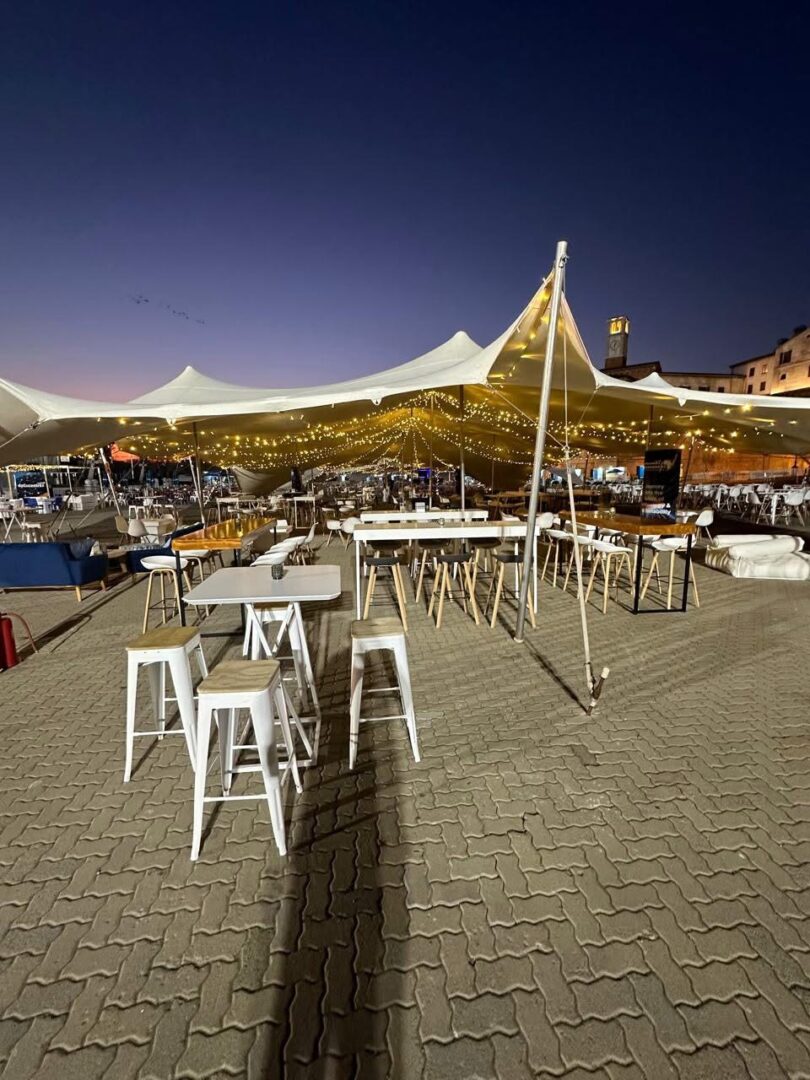 EBS exhibition booth setup inside a large expo hall with lights and banners